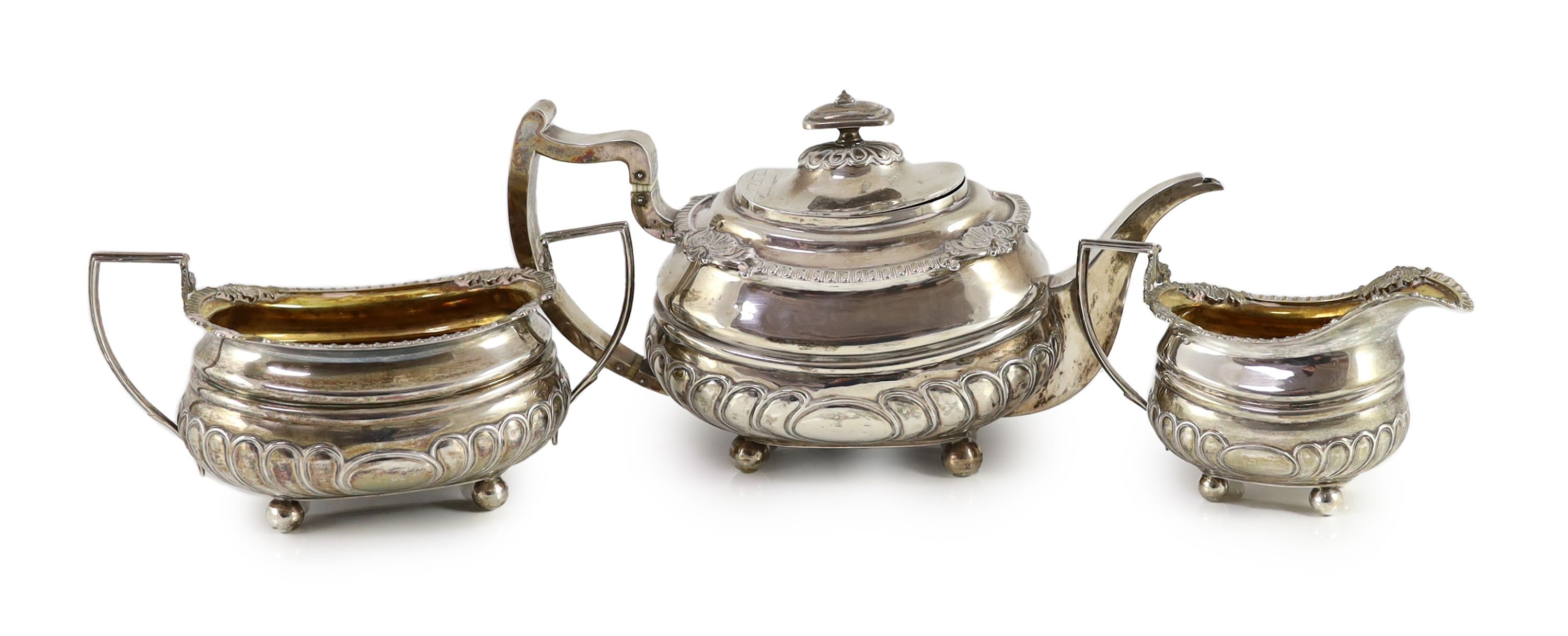 A George III Scottish silver demi-fluted three piece tea set by George Fenwick